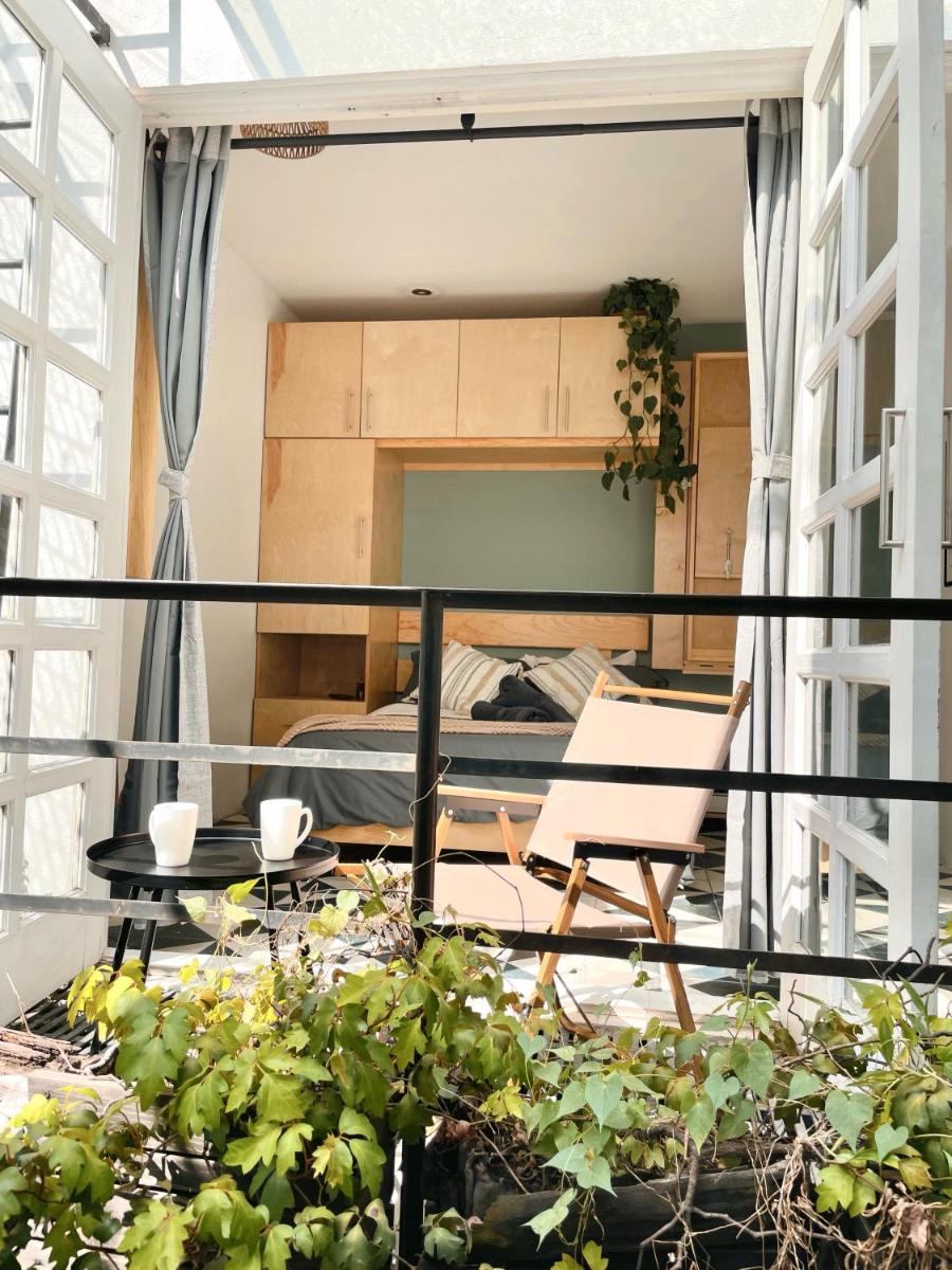 Sunlit Studio with Balcony and Workspace
