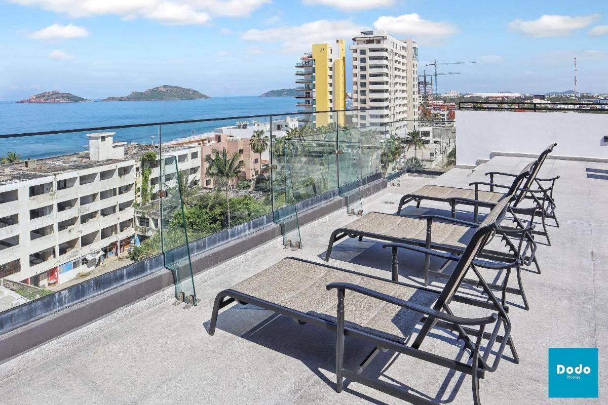 Torre con roof garden y piscina vista al mar